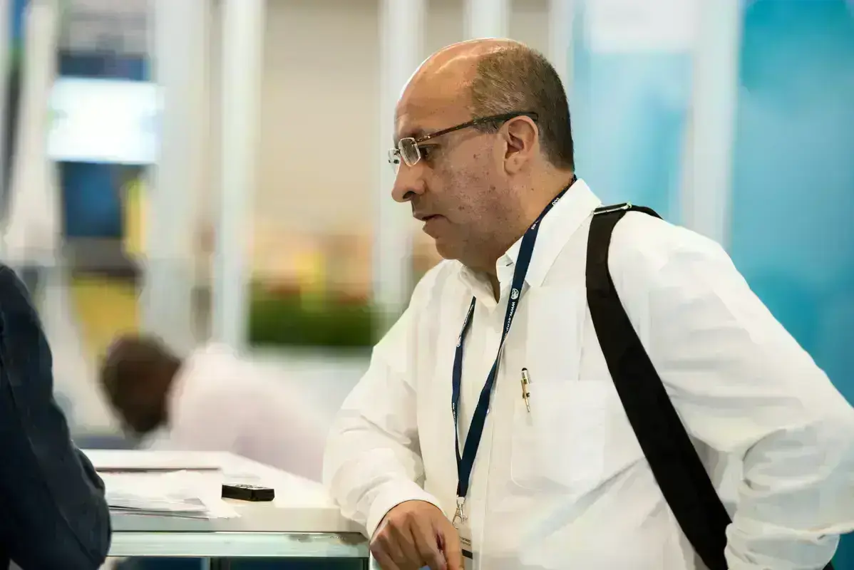Dr Miguel Rangel leaning on counter